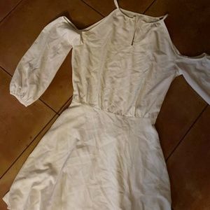 White dress with cold off the shoulder design. A-line knee length skirt. Size S